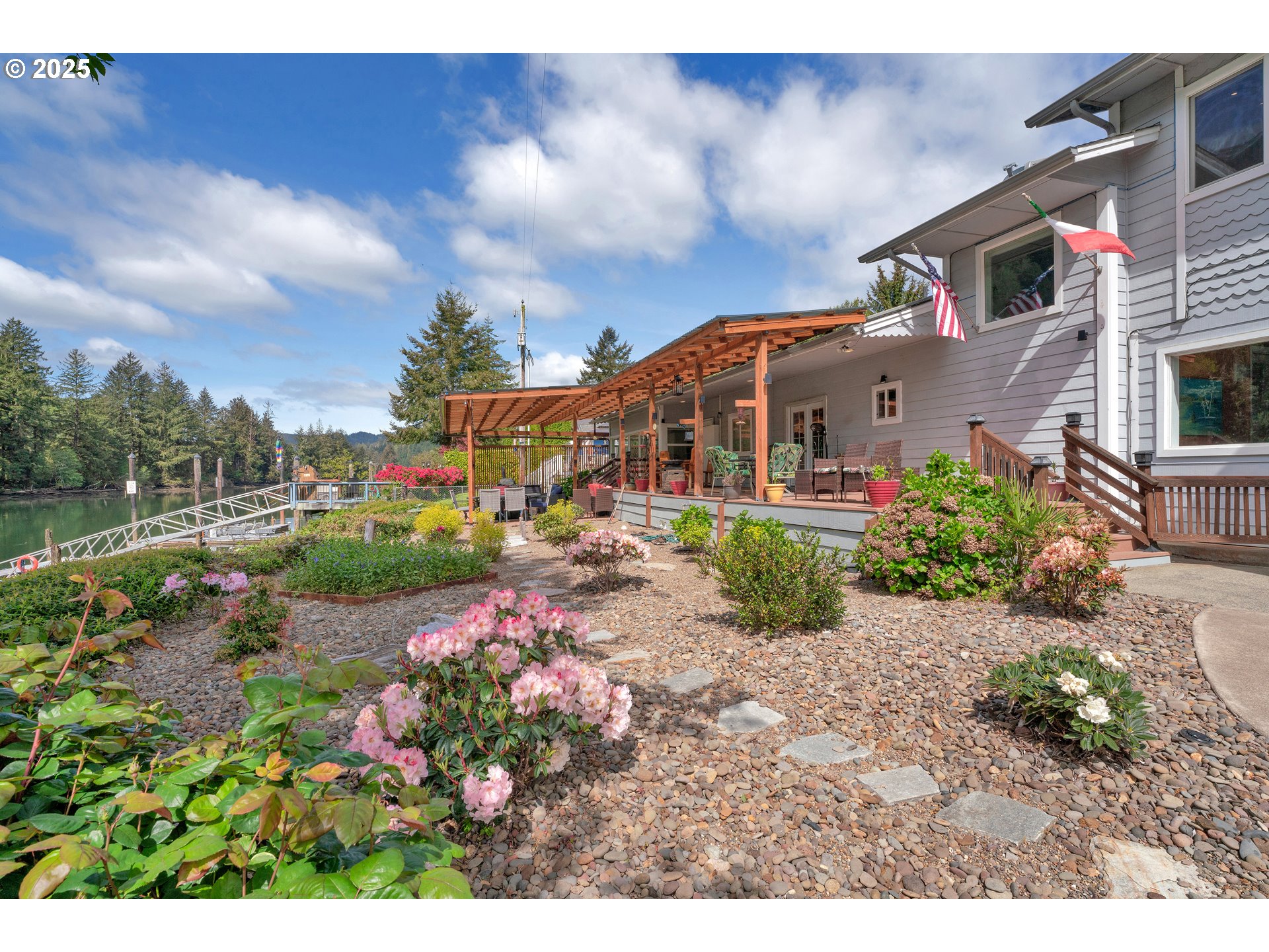 9202 Phey Lane Florence, OR 97439 - Photo 45 of 47 a view of a house with a garden