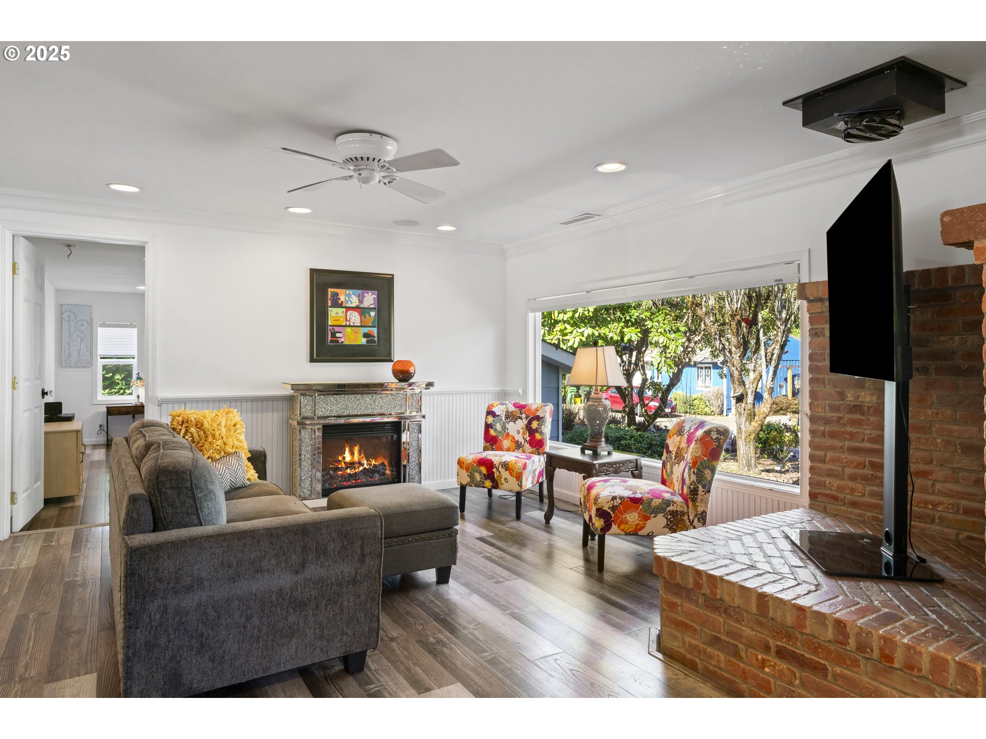 9202 Phey Lane Florence, OR 97439 - Photo 8 of 47 a living room with furniture a fireplace and a flat screen tv