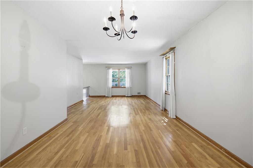 4188 Cedar Valley Lane Conley, GA 30288 - Photo 8 of 28 a view of empty room with wooden floor