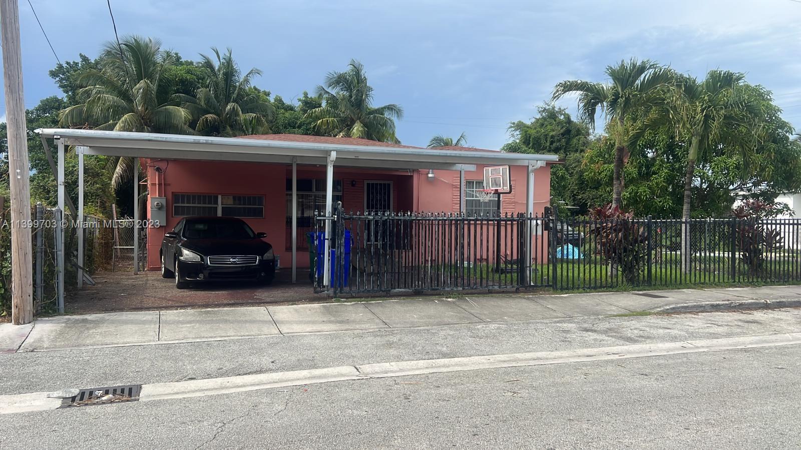 a view of a car park in front of house