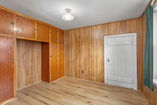 a view of a livingroom with wooden walls