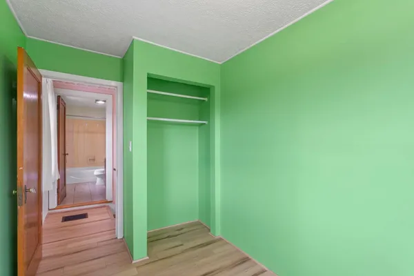 a view of room with window and entryway