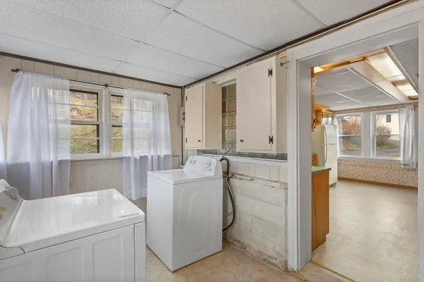 a bathroom with a sink a toilet and tub