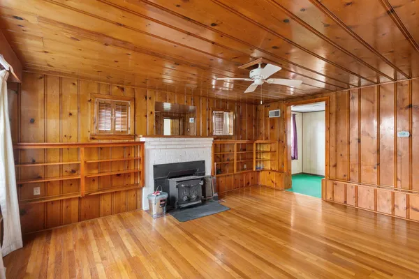 a view of a livingroom with furniture and a fireplace