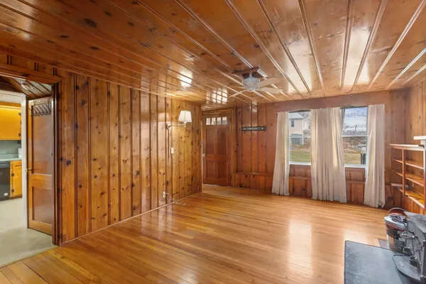 a view of hallway with wooden floor