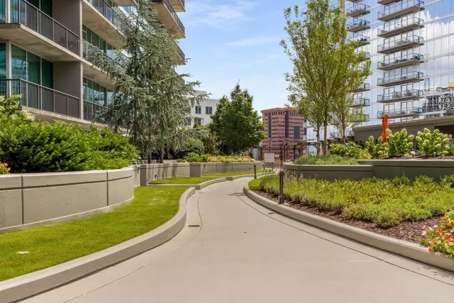 a view of balcony with outdoor seating and city view