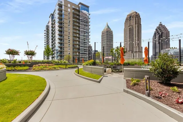 a view of a swimming pool with outdoor seating