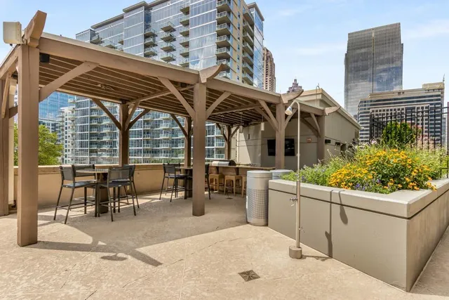 a view of a swimming pool with outdoor seating