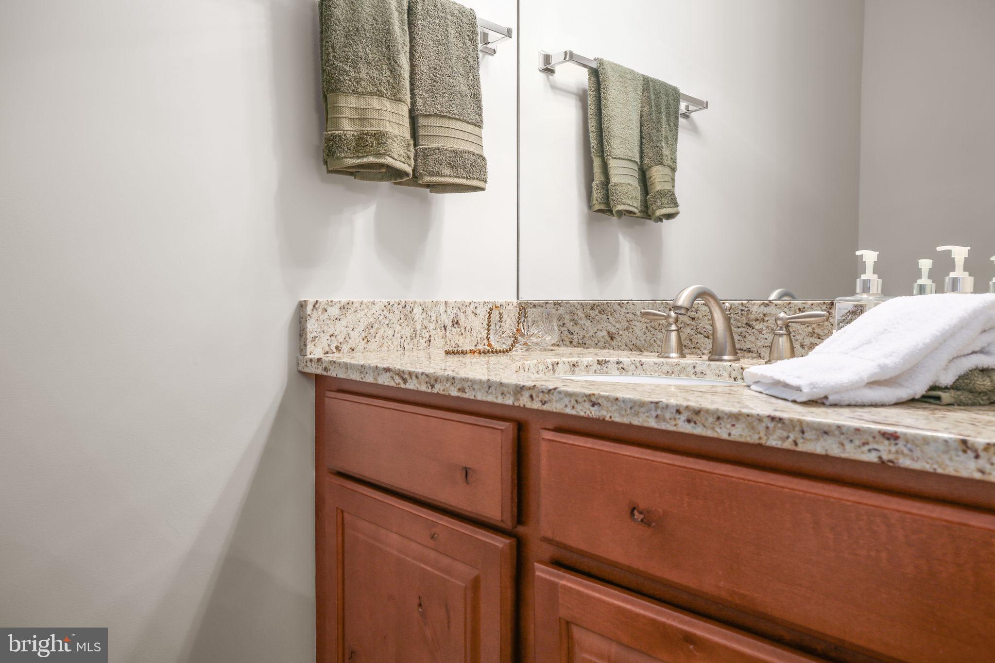 229 Mill Street Occoquan, VA 22125 - Photo 16 of 61 a bathroom with a granite countertop sink and a mirror
