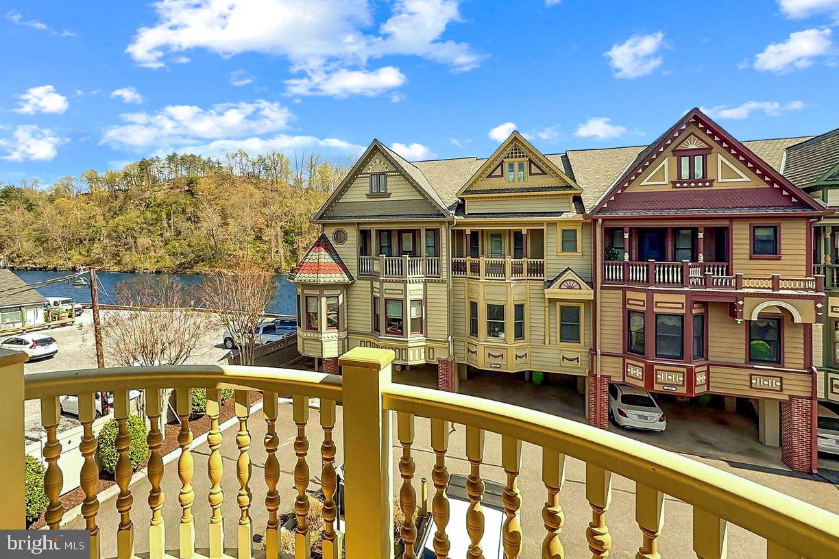 229 Mill Street Occoquan, VA 22125 - Photo 24 of 61 a front view of a residential houses with yard