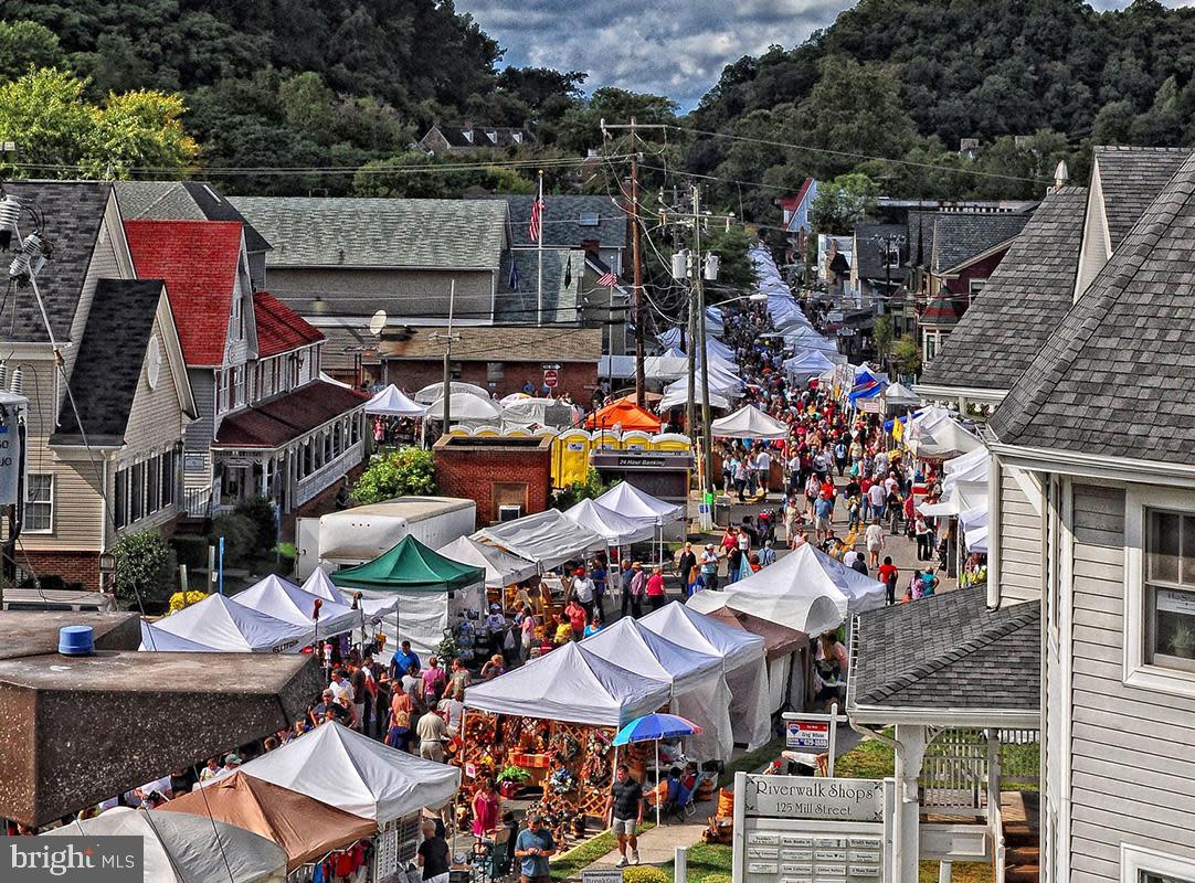 229 Mill Street Occoquan, VA 22125 - Photo 57 of 61 a group of people sitting outside a city