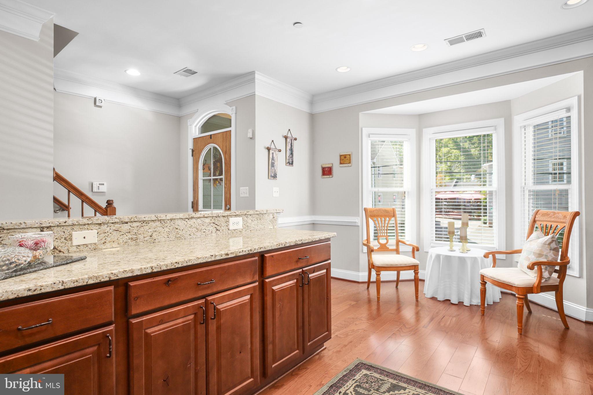 229 Mill Street Occoquan, VA 22125 - Photo 7 of 61 a living room with granite countertop furniture a flat screen tv and a large window