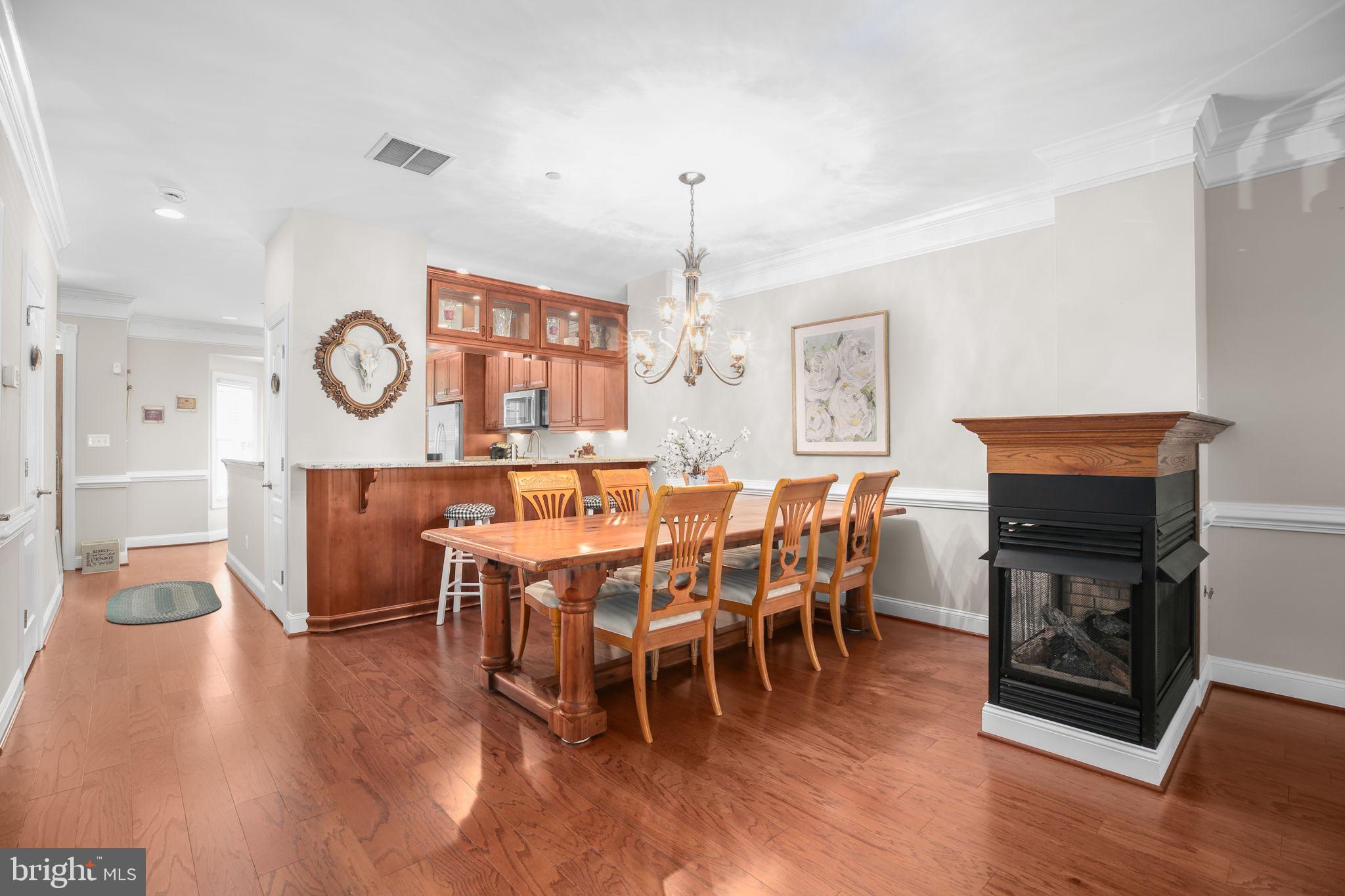 229 Mill Street Occoquan, VA 22125 - Photo 9 of 61 a view of a dining room with furniture window and wooden floor