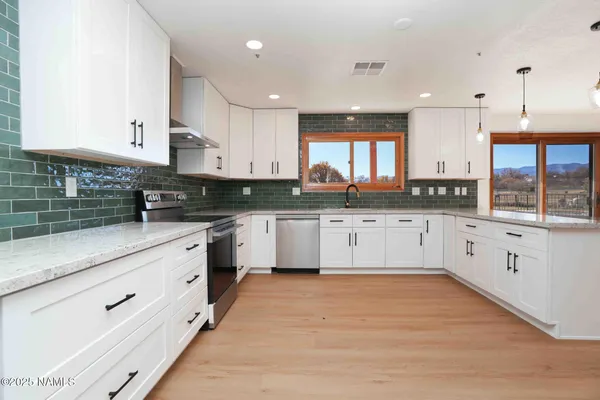 a view of hallway with wooden floor
