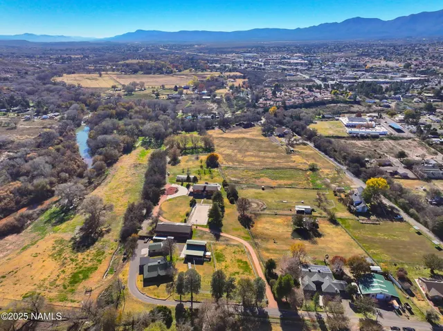 an aerial view of residential houses with outdoor space