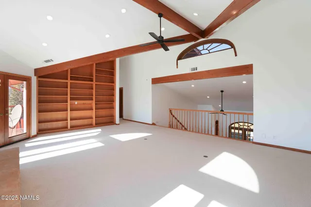 a view of empty room with floor to ceiling window