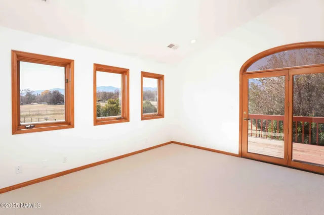 a bathroom with a granite countertop sink a mirror and a bathtub