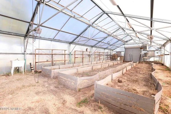 a view of an empty room with a cabinet