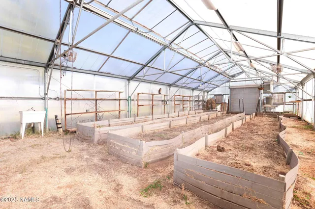 a view of an empty room with a cabinet