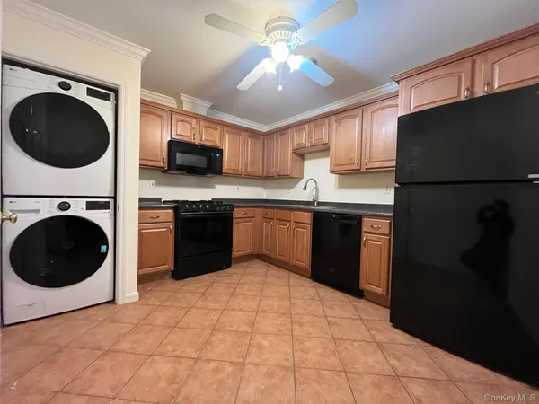 a kitchen with a sink a stove and refrigerator