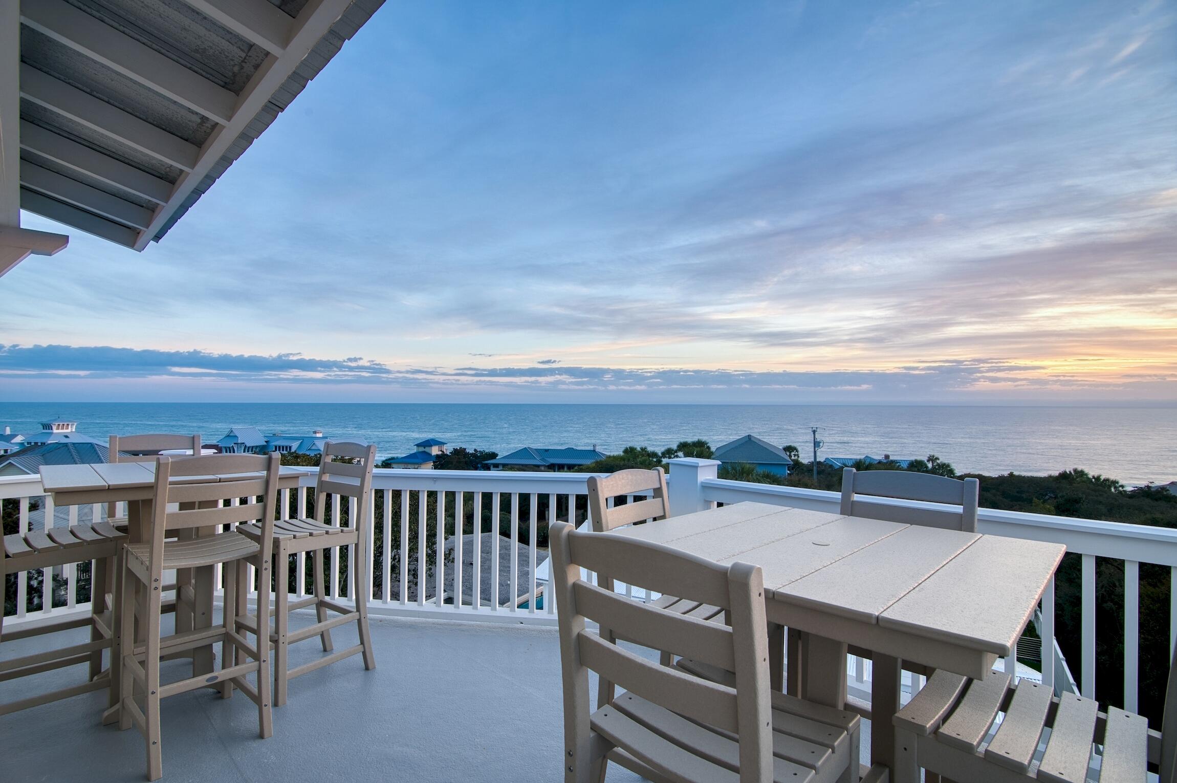 a view of a balcony with furniture