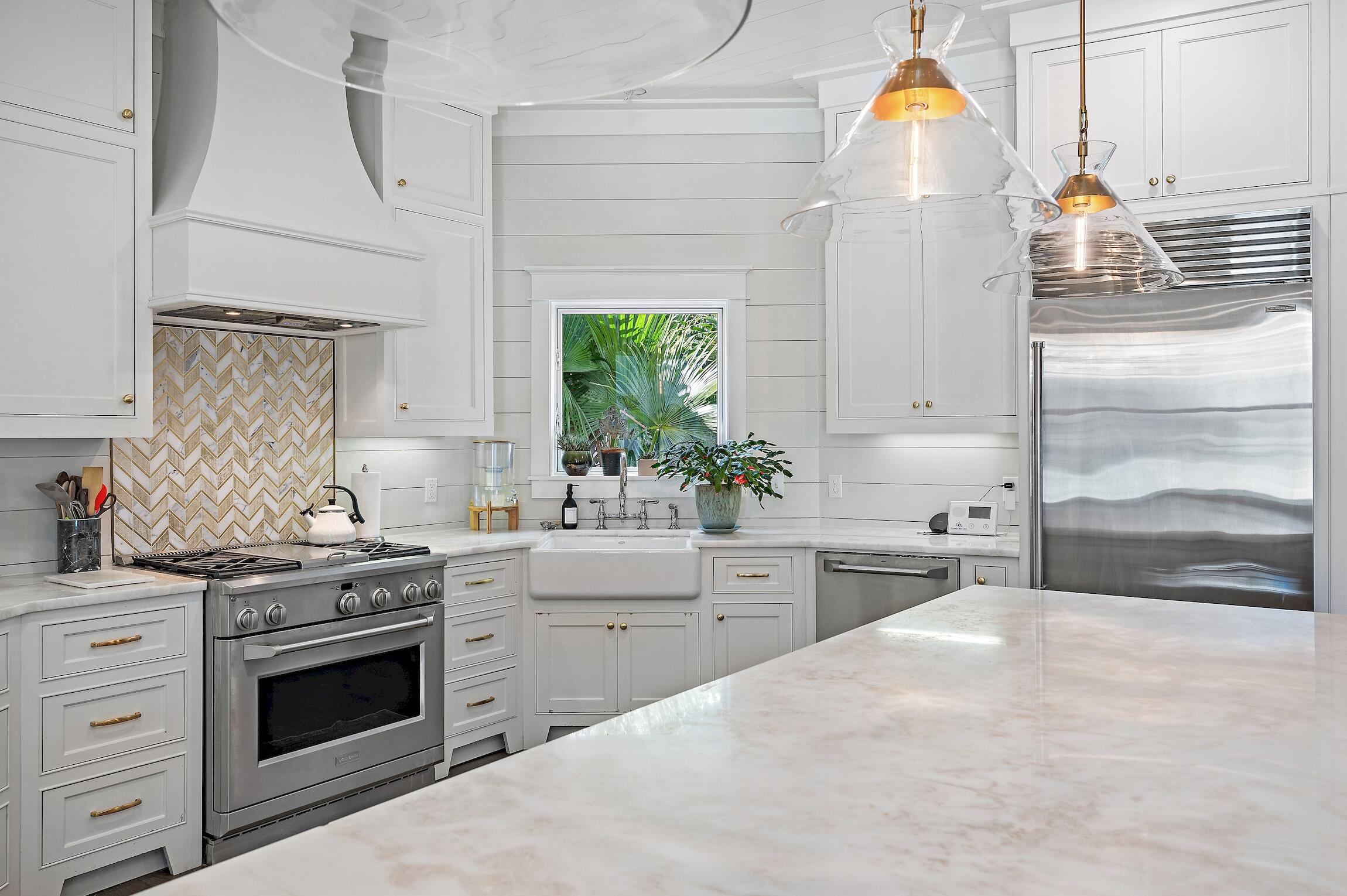 87 Bullard Road Santa Rosa Beach, FL 32459 - Photo 15 of 37 a kitchen with a stove a sink and a refrigerator
