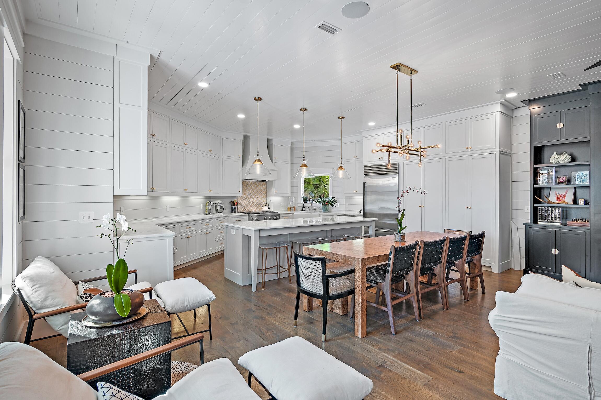87 Bullard Road Santa Rosa Beach, FL 32459 - Photo 16 of 37 a kitchen with a dining table chairs and view of living room