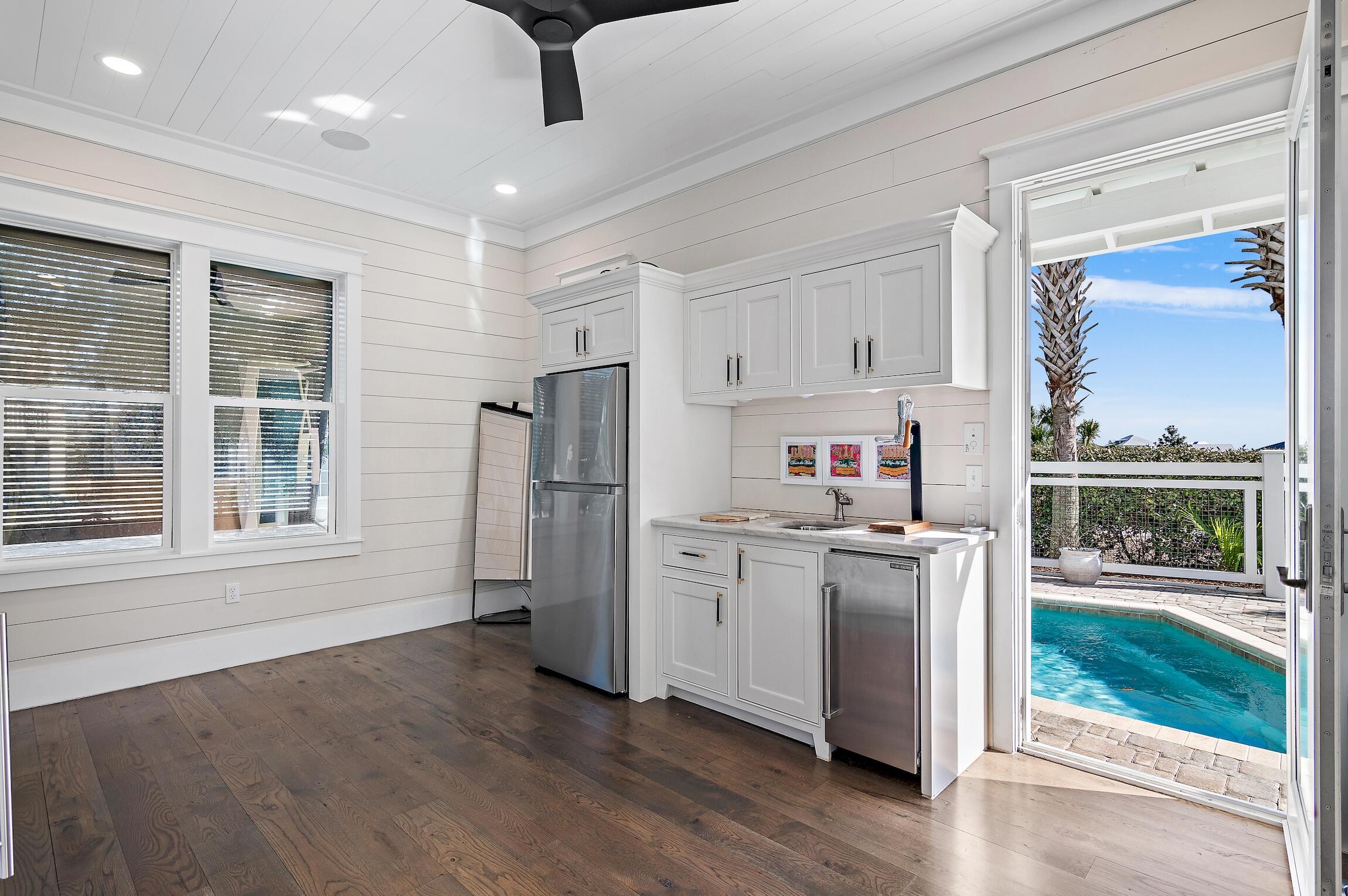 87 Bullard Road Santa Rosa Beach, FL 32459 - Photo 17 of 37 a kitchen with stainless steel appliances granite countertop a refrigerator and a stove