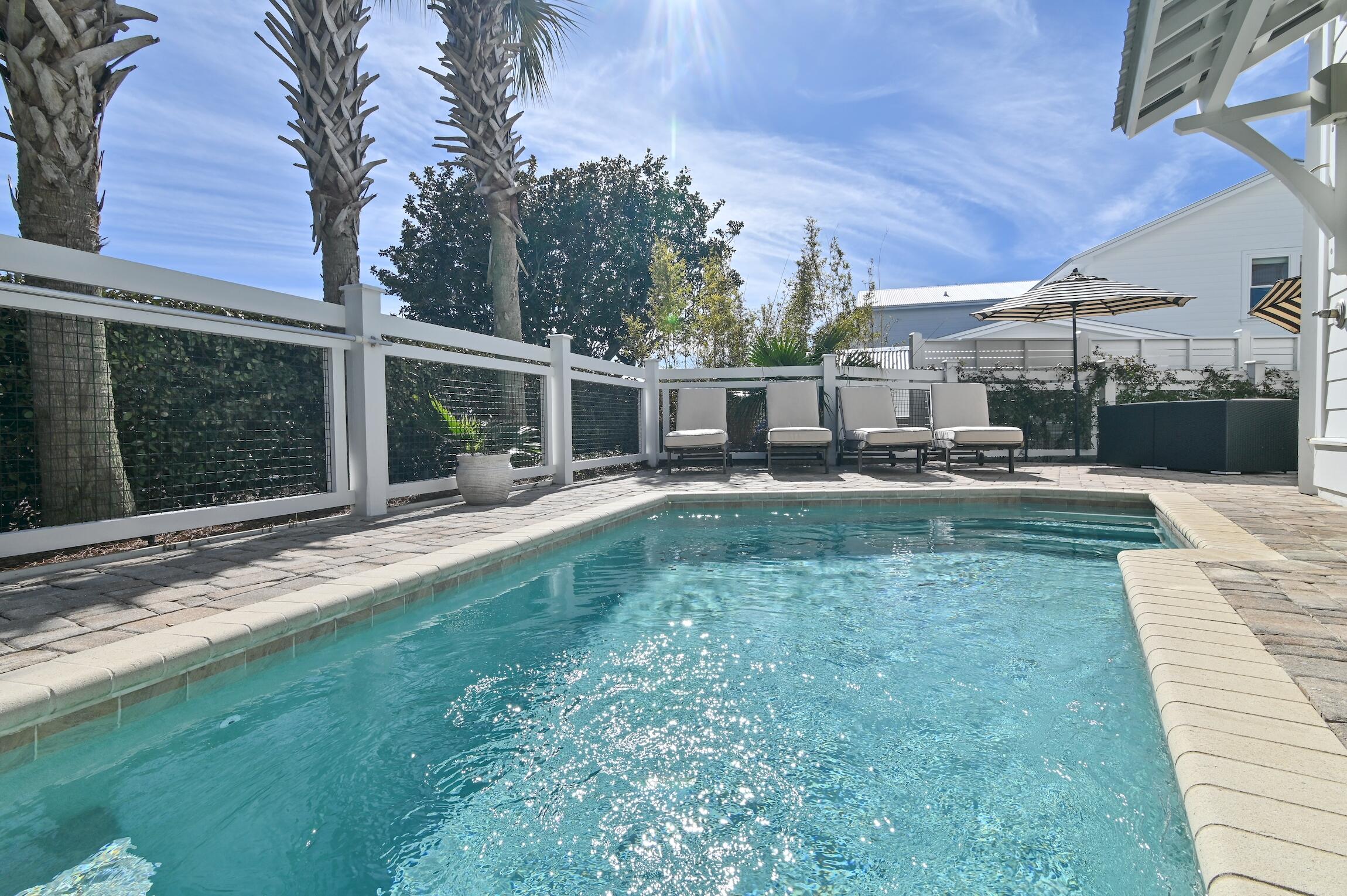 87 Bullard Road Santa Rosa Beach, FL 32459 - Photo 18 of 37 a house view with swimming pool and chairs