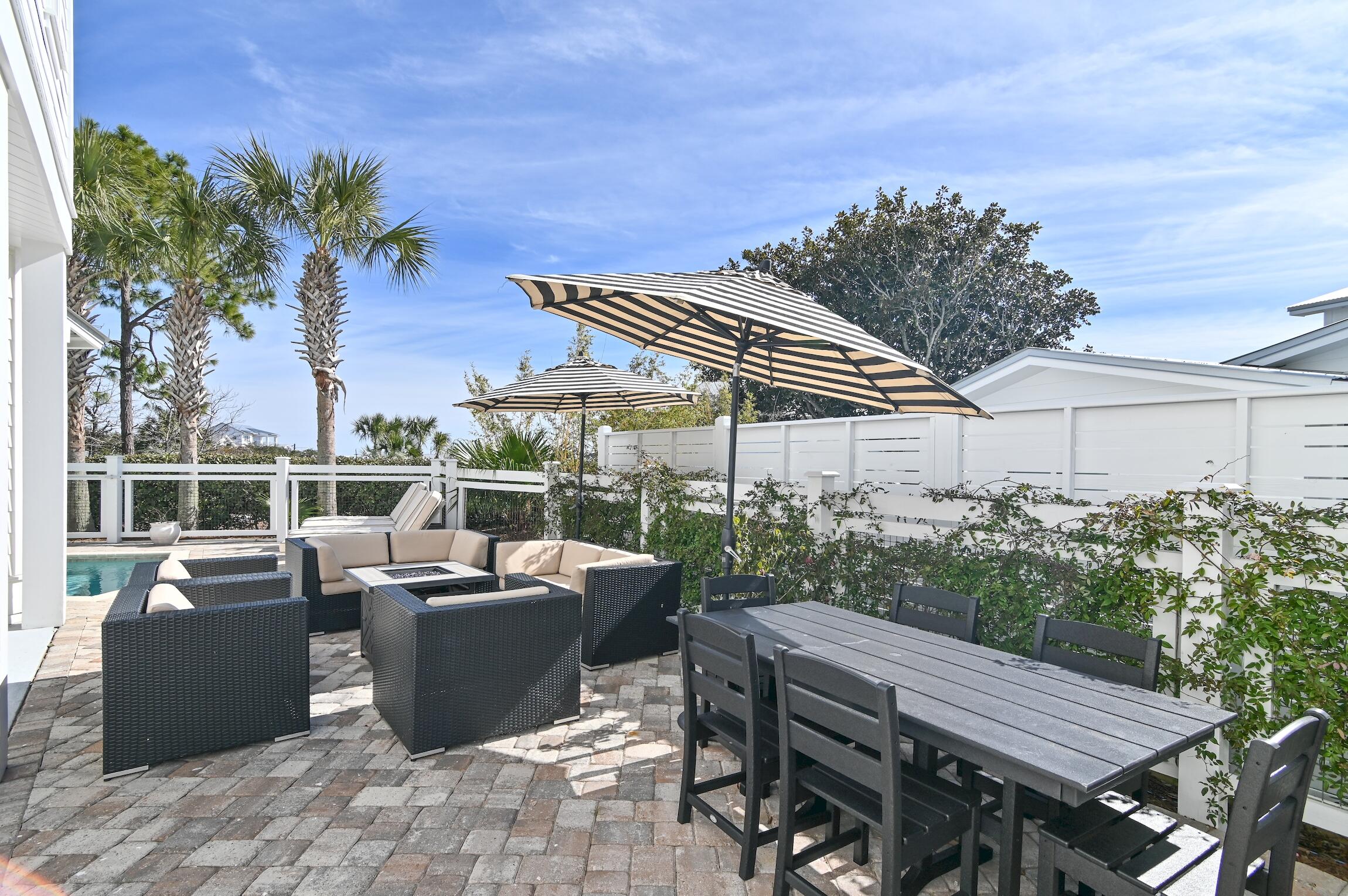 87 Bullard Road Santa Rosa Beach, FL 32459 - Photo 21 of 37 a view of a patio with couches chairs and potted plants