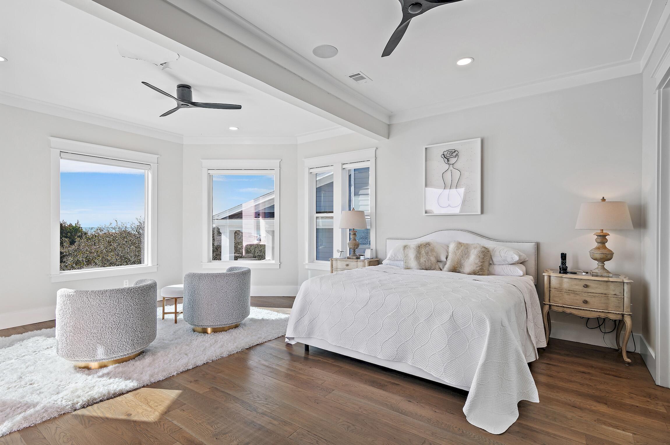 87 Bullard Road Santa Rosa Beach, FL 32459 - Photo 22 of 37 a bedroom with a large bed and a potted plant