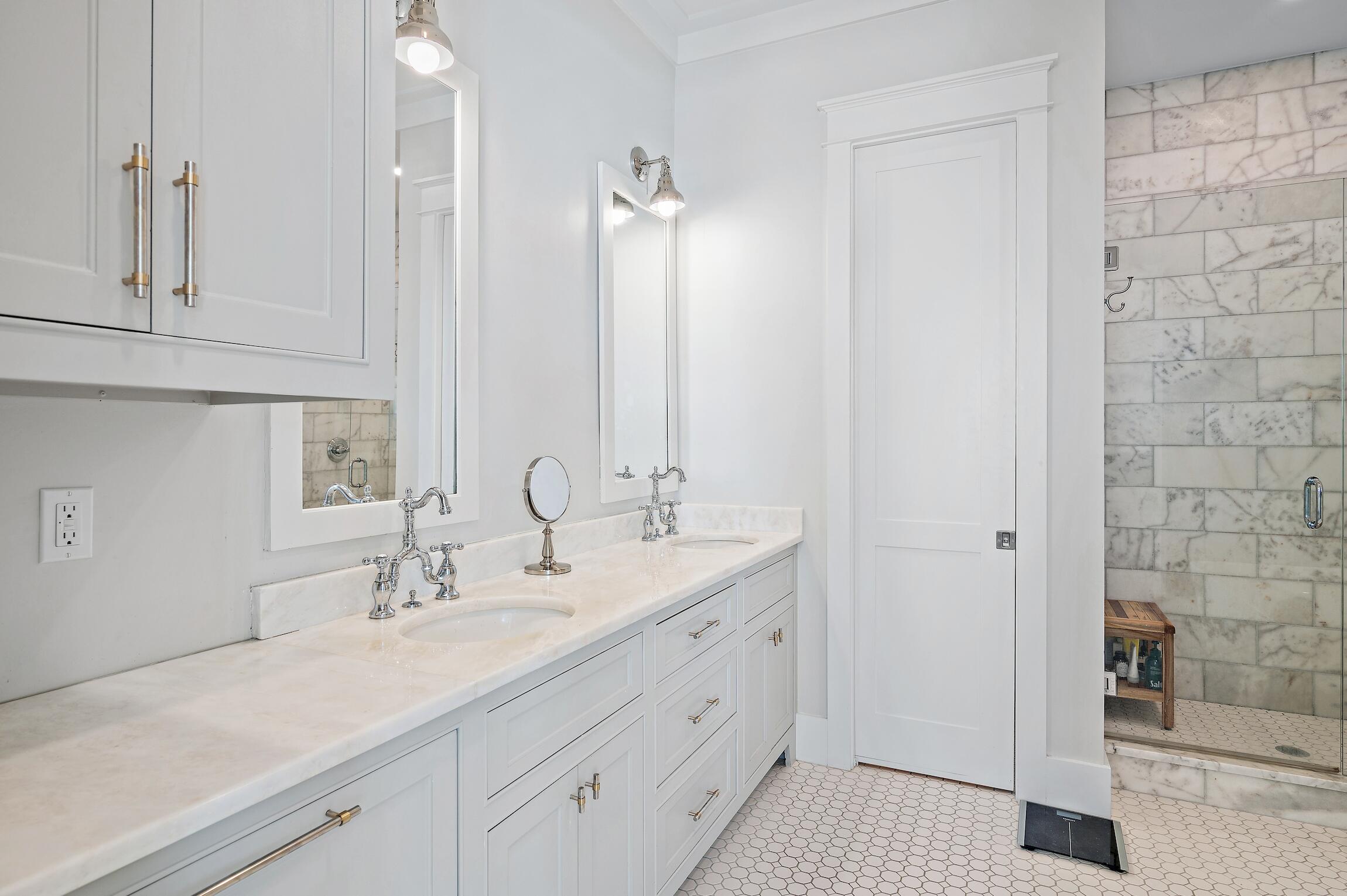 87 Bullard Road Santa Rosa Beach, FL 32459 - Photo 25 of 37 a bathroom with a double vanity sink and a mirror