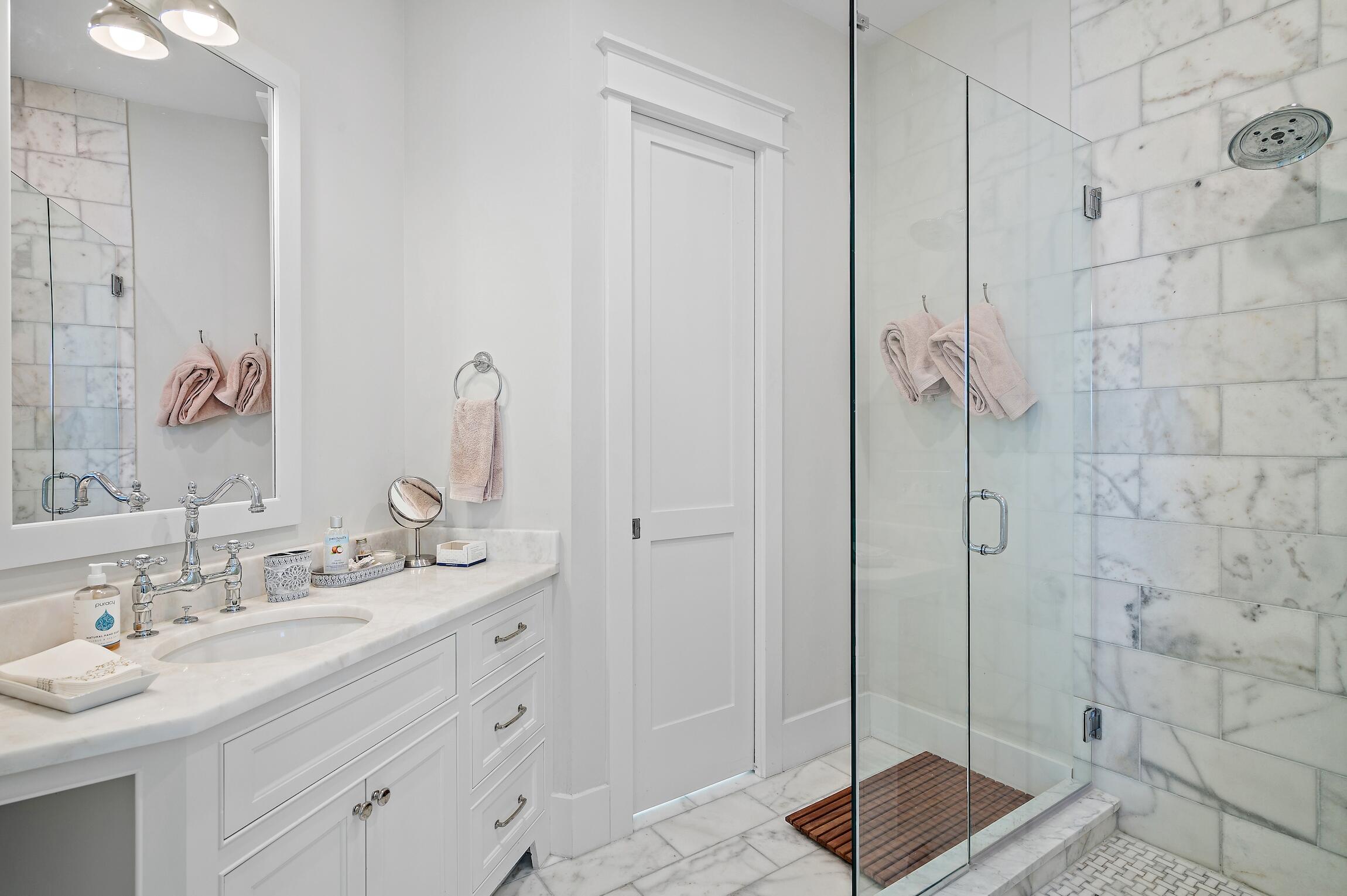 87 Bullard Road Santa Rosa Beach, FL 32459 - Photo 28 of 37 a bathroom with a shower sink and mirror