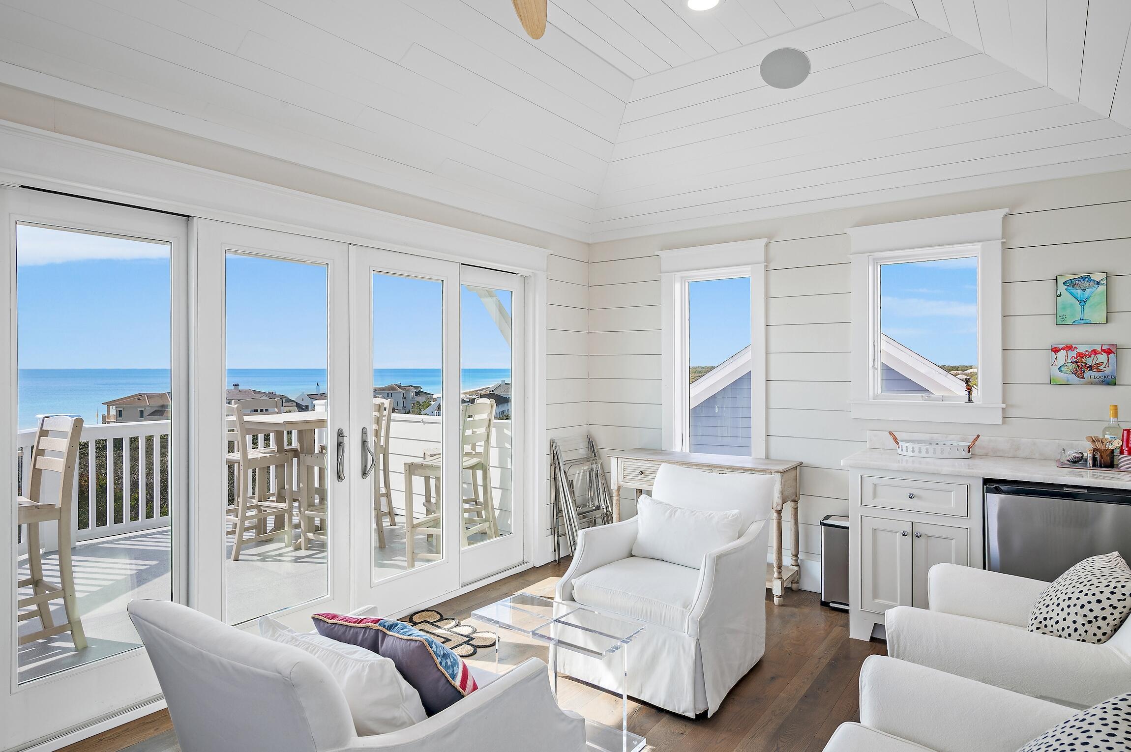 87 Bullard Road Santa Rosa Beach, FL 32459 - Photo 33 of 37 a living room with furniture fireplace and a large window