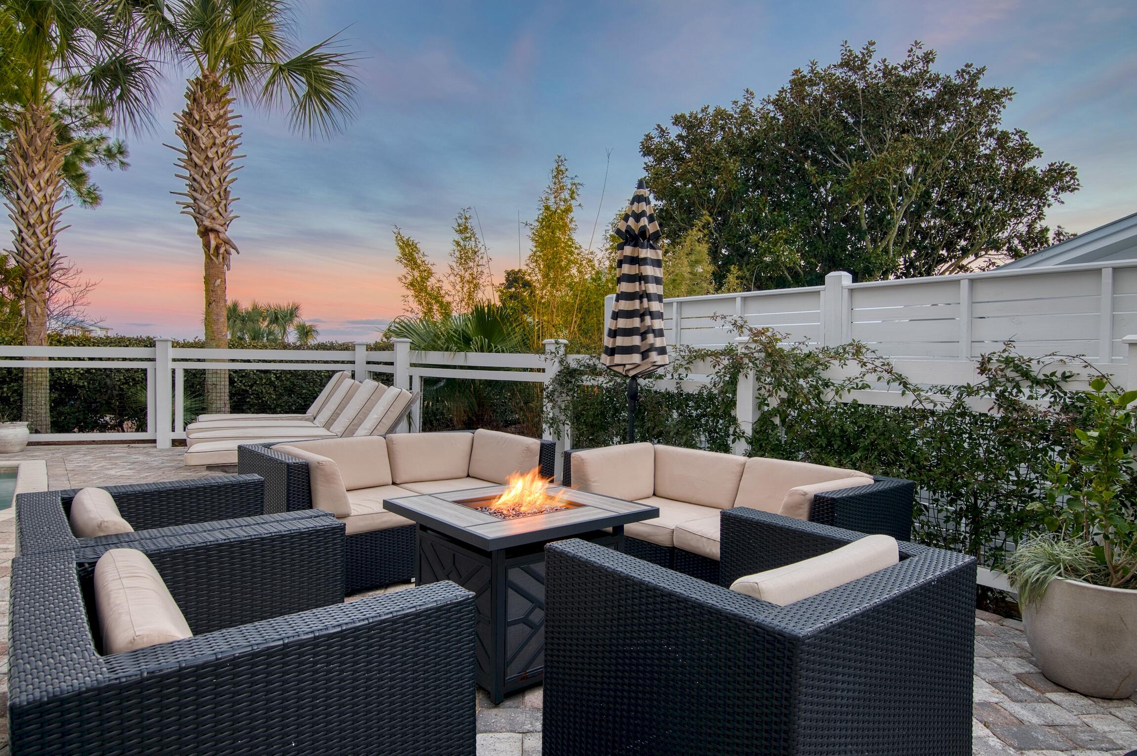 87 Bullard Road Santa Rosa Beach, FL 32459 - Photo 4 of 37 a view of a patio with couches chairs and a potted plant