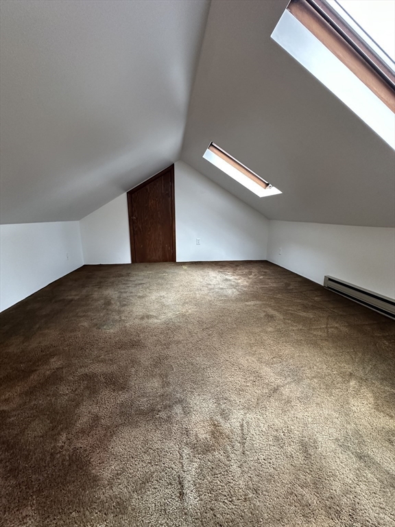 38 Byron Street, Unit 2 Wakefield, MA 01880 - Photo 7 of 10 a view of an empty room with wooden floor