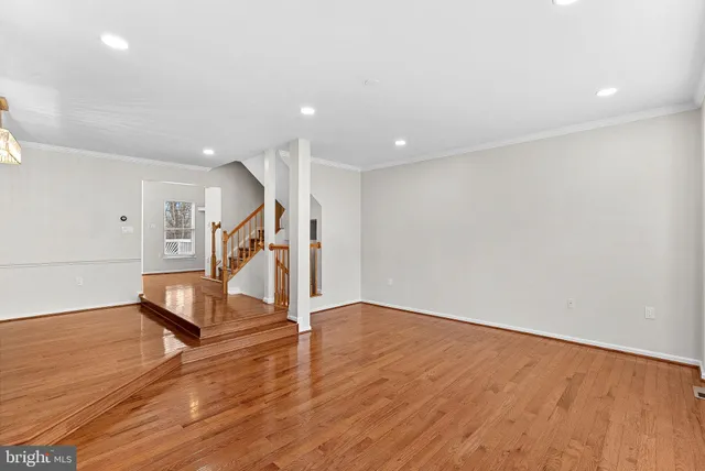a view of an entryway with wooden floor