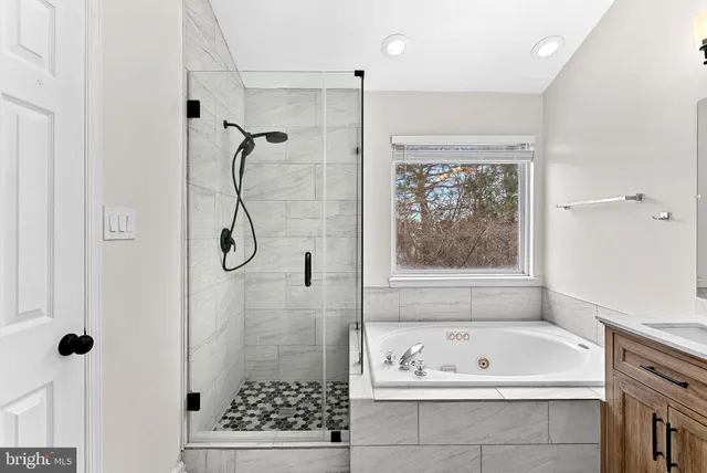 a bathroom with a bath tub and a shower