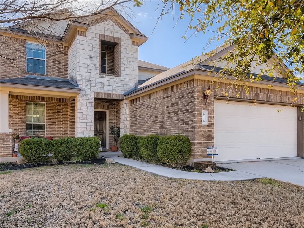 616 Bayou Bend Drive Buda, TX 78610 - Photo 1 of 1 a front view of a house with garden