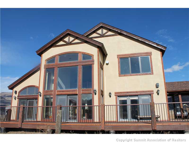 1060 Lindstrom Road Silverthorne, CO 80498 - Photo 2 of 25 Exterior Back. Wall of glass to take in the endless Gore Range Views