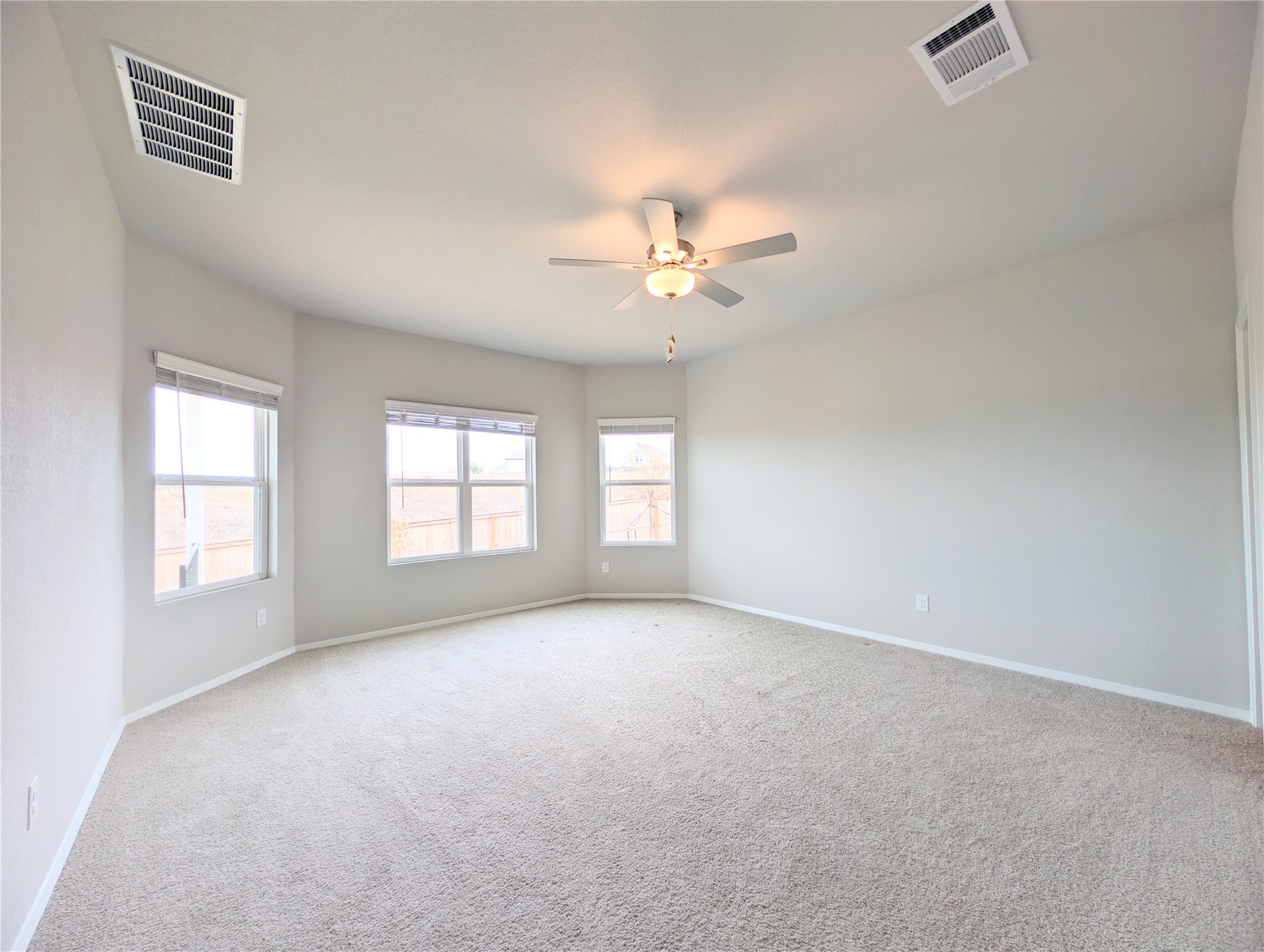5524 Sacra Cove Austin, TX 78747 - Photo 19 of 37 Primary bedroom with baseboards and a ceiling fan