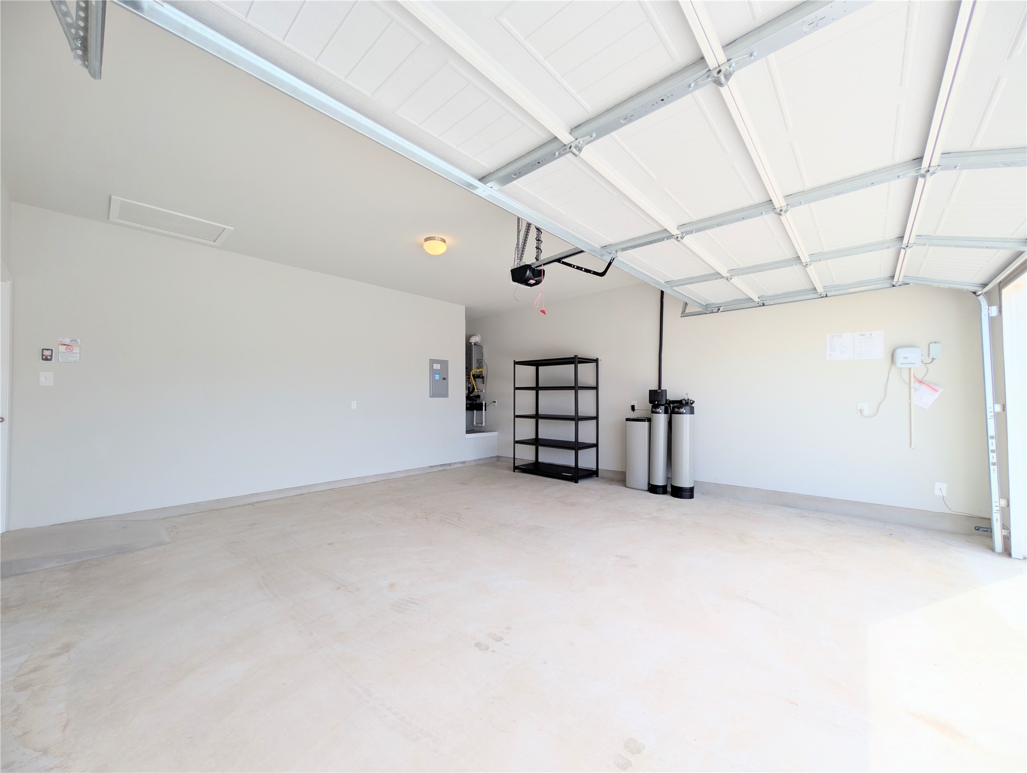 5524 Sacra Cove Austin, TX 78747 - Photo 26 of 37 Garage / water softener / electric panel / irrigation system