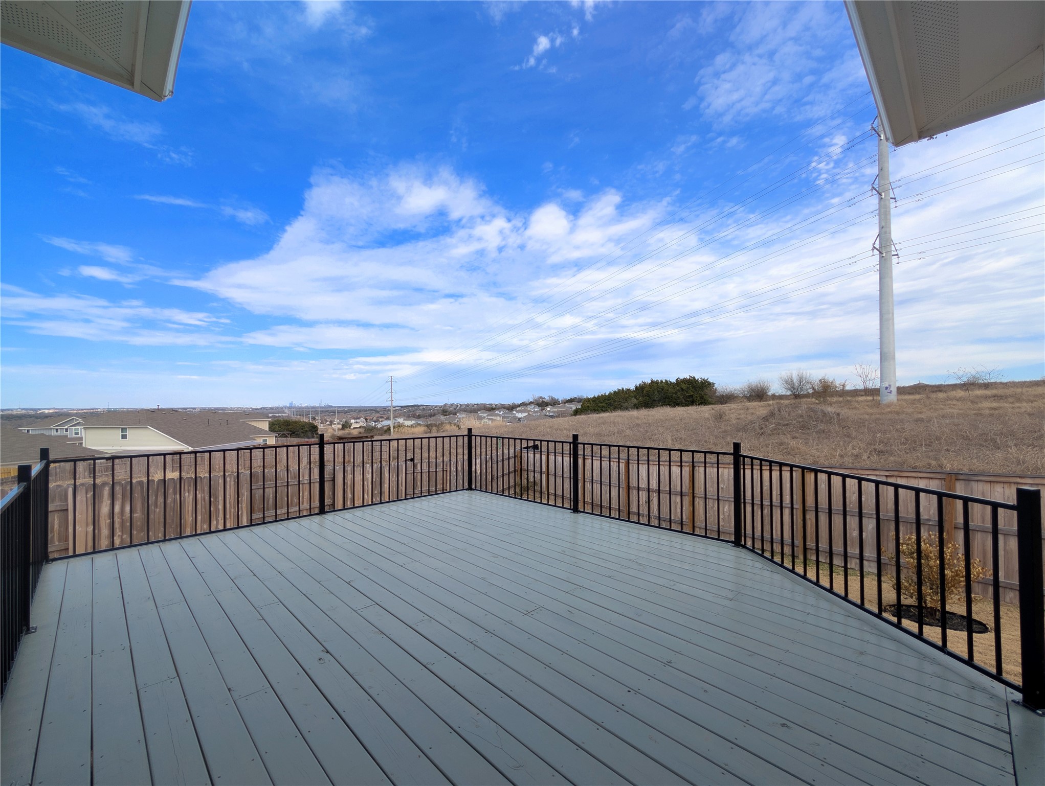 5524 Sacra Cove Austin, TX 78747 - Photo 28 of 37 Custom wooden deck featuring a skyline & private view
