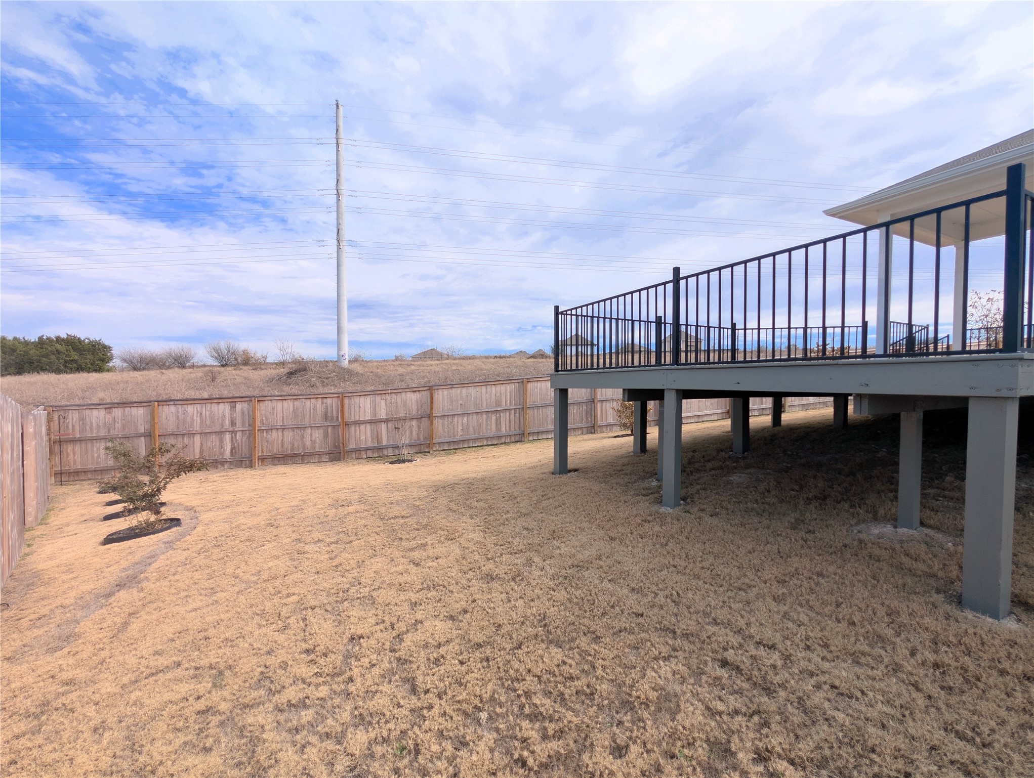 5524 Sacra Cove Austin, TX 78747 - Photo 35 of 37 Fenced backyard with a deck