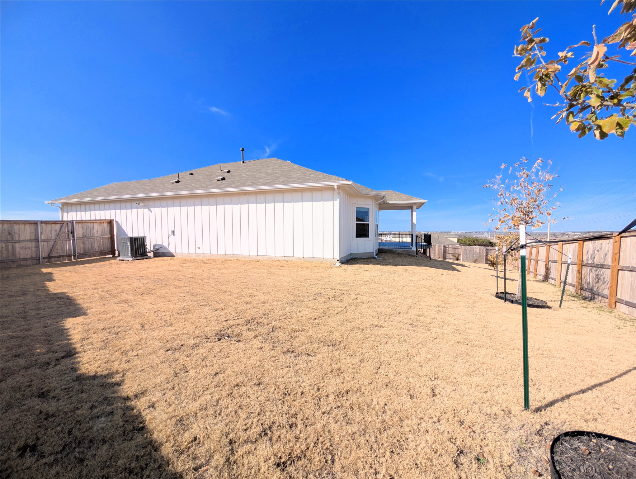 5524 Sacra Cove Austin, TX 78747 - Photo 37 of 37 Rear view of property featuring a fenced backyard and a shingled roof