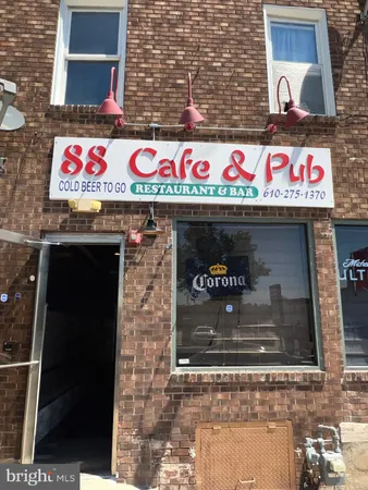 a sign that is on the side of a brick building