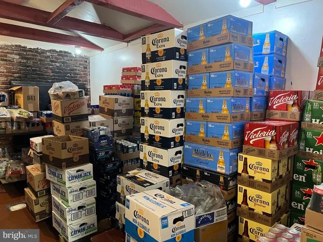 a kitchen with stainless steel appliances kitchen island granite countertop a stove and cabinets