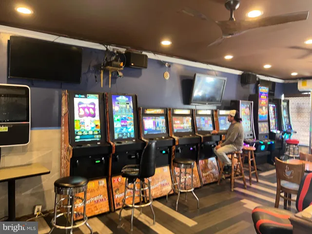 a living room with lots of furniture and a flat screen tv