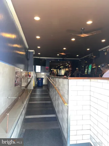 a lobby with furniture and a rug