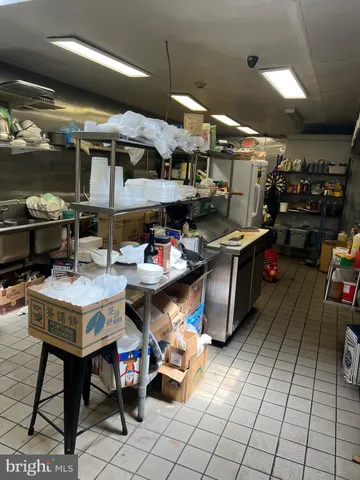 a view of a patio with table and chairs